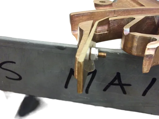 A zoomed in shot of a scraper blade on a feed frame.